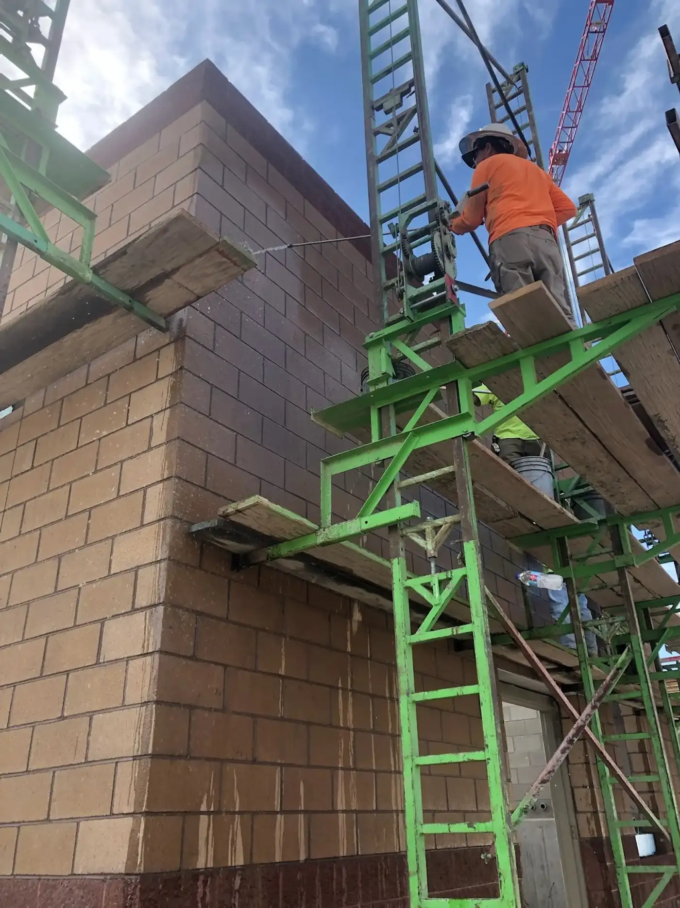 Heritage Masonry crew laying commercial block masonry on scaffolding in Western Colorado